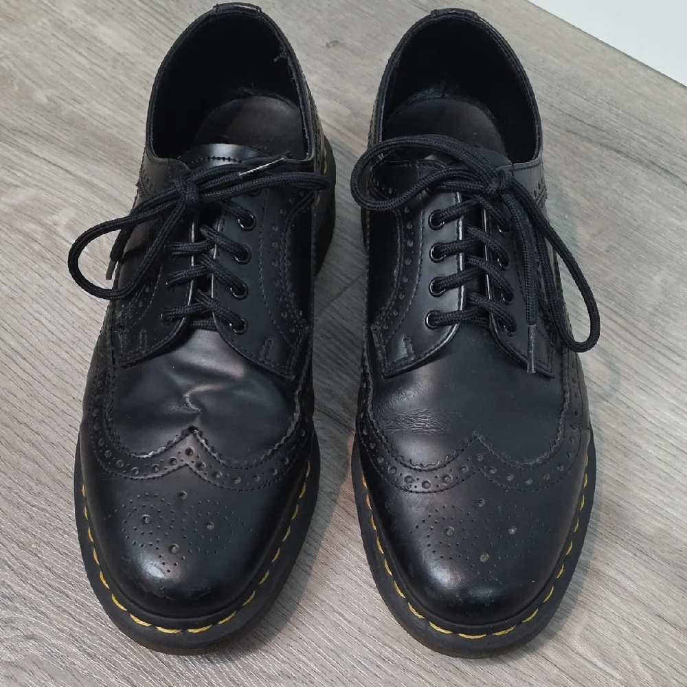 Dr. Martens Black Leather Wingtip Oxfords with Yellow Stitching